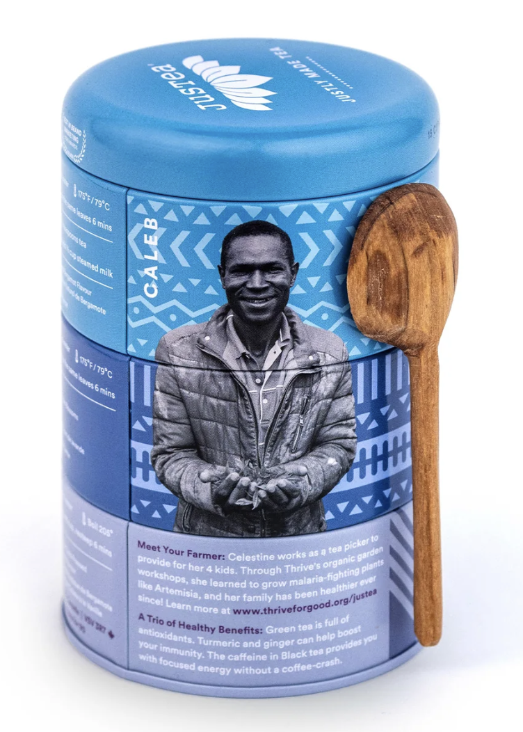 A tin of Earl Grey tea that includes a wooden spoon with an artisan on the cover