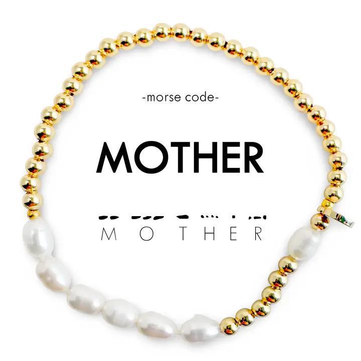 Bracelet with gold and pearl beads spelling &