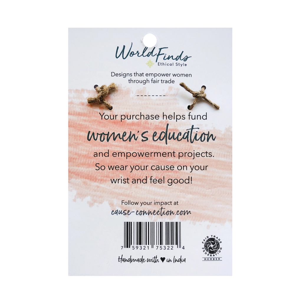 The back of a World Finds product tag speaking on women&