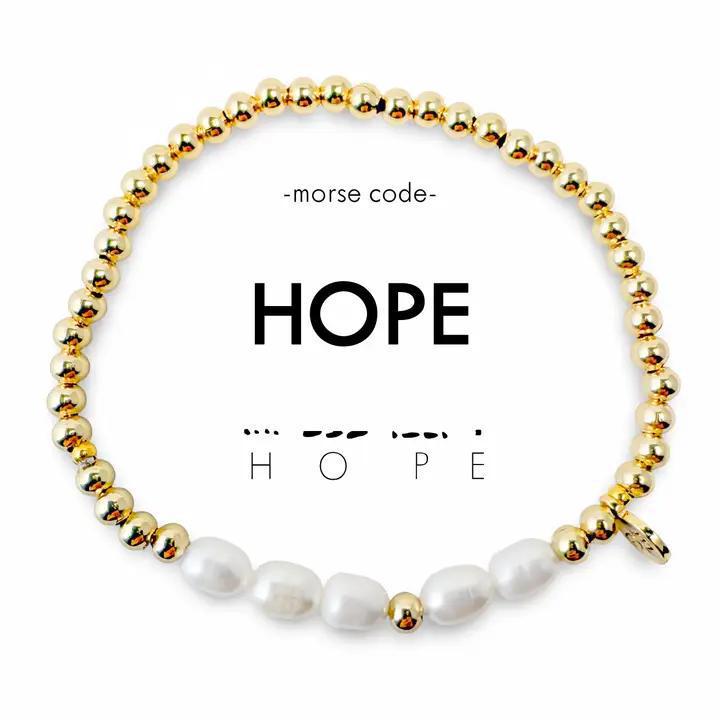 Bracelet with gold and pearl beads spelling &