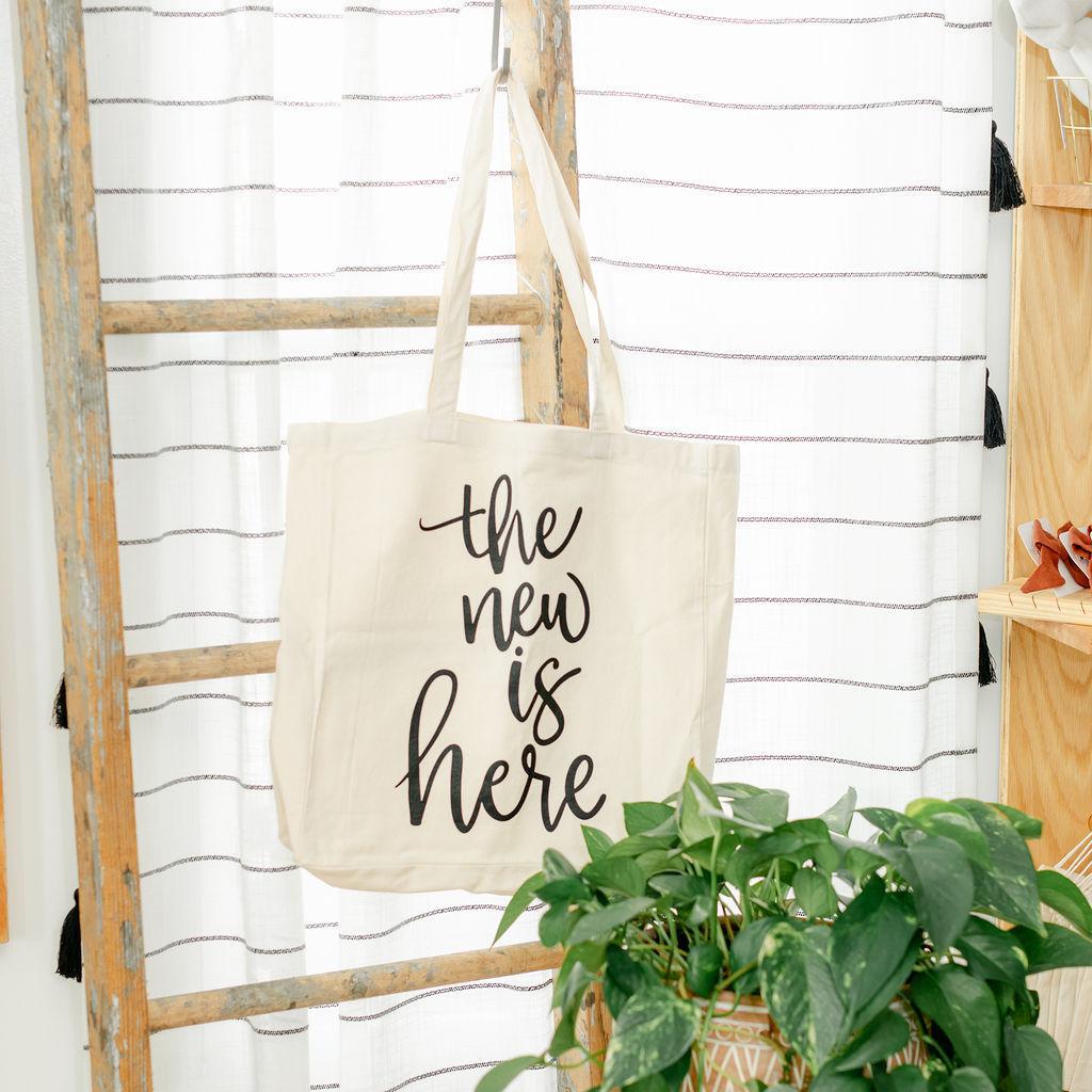 Beige tote bag with &