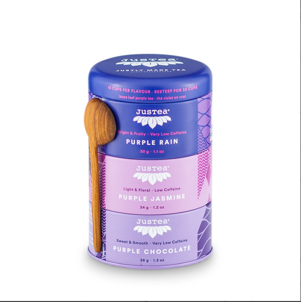 Purple three tiered tea tin featuring loose leaf teas - Purple Rain, Purple Jasmine, and Purple Chocolate - with a wooden spoon on a white background.