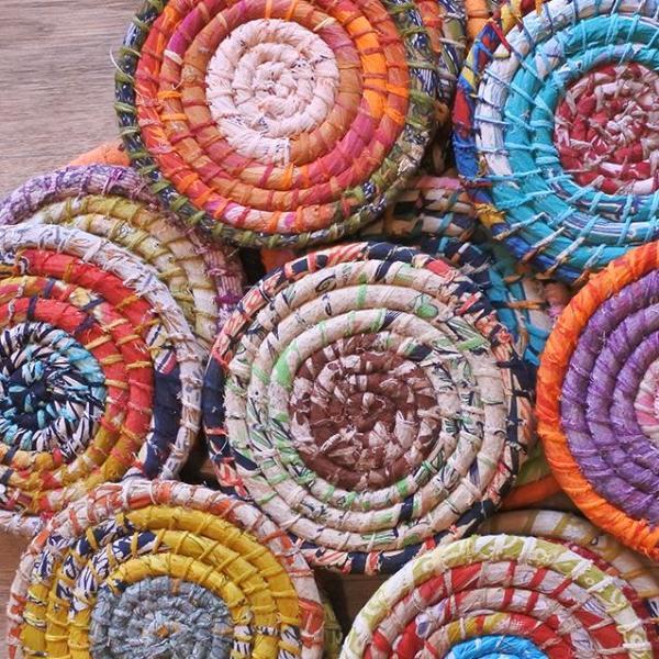 A large collection of colorful trivets