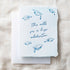 Graduation-themed card with blue text and illustrations on a textured beige background