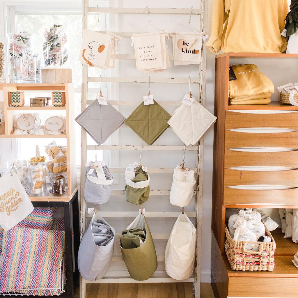 Store interior with shelves displaying various bags and items