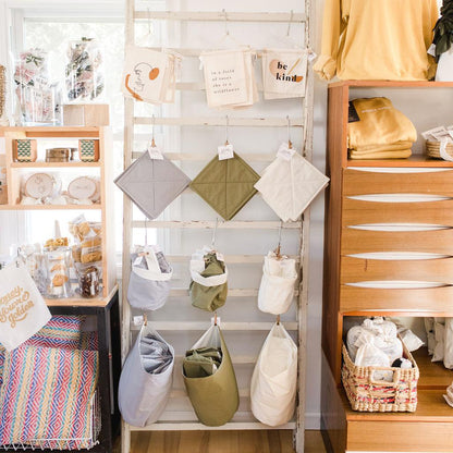 Store interior with shelves displaying various bags and items