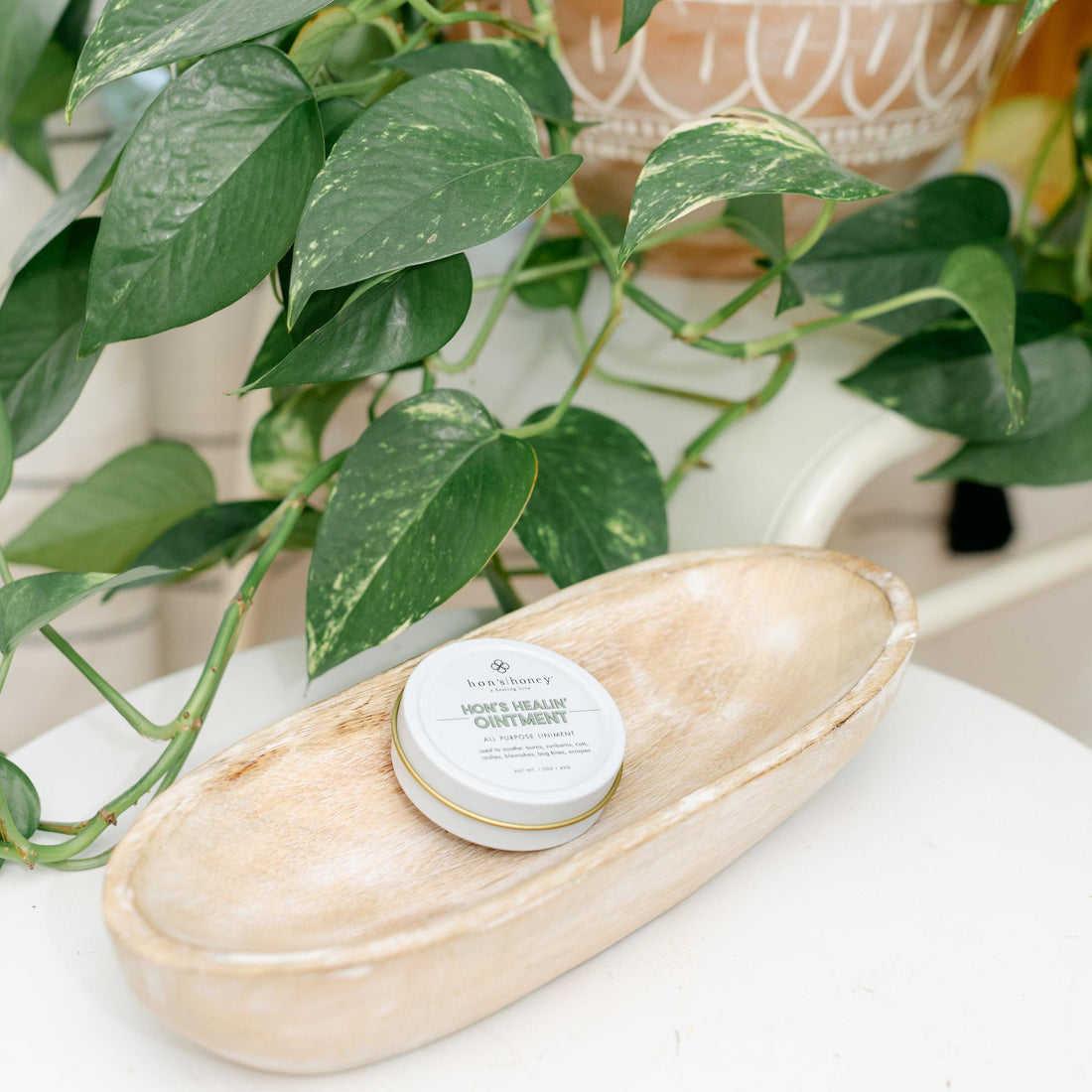 Small white tin with &