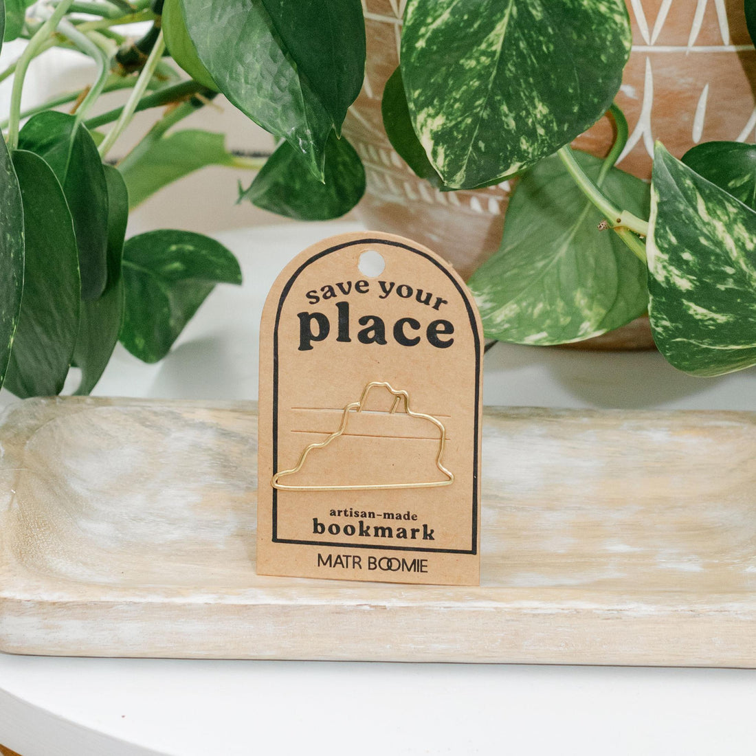 Metal bookmark in the shape of Virginia on a card with &