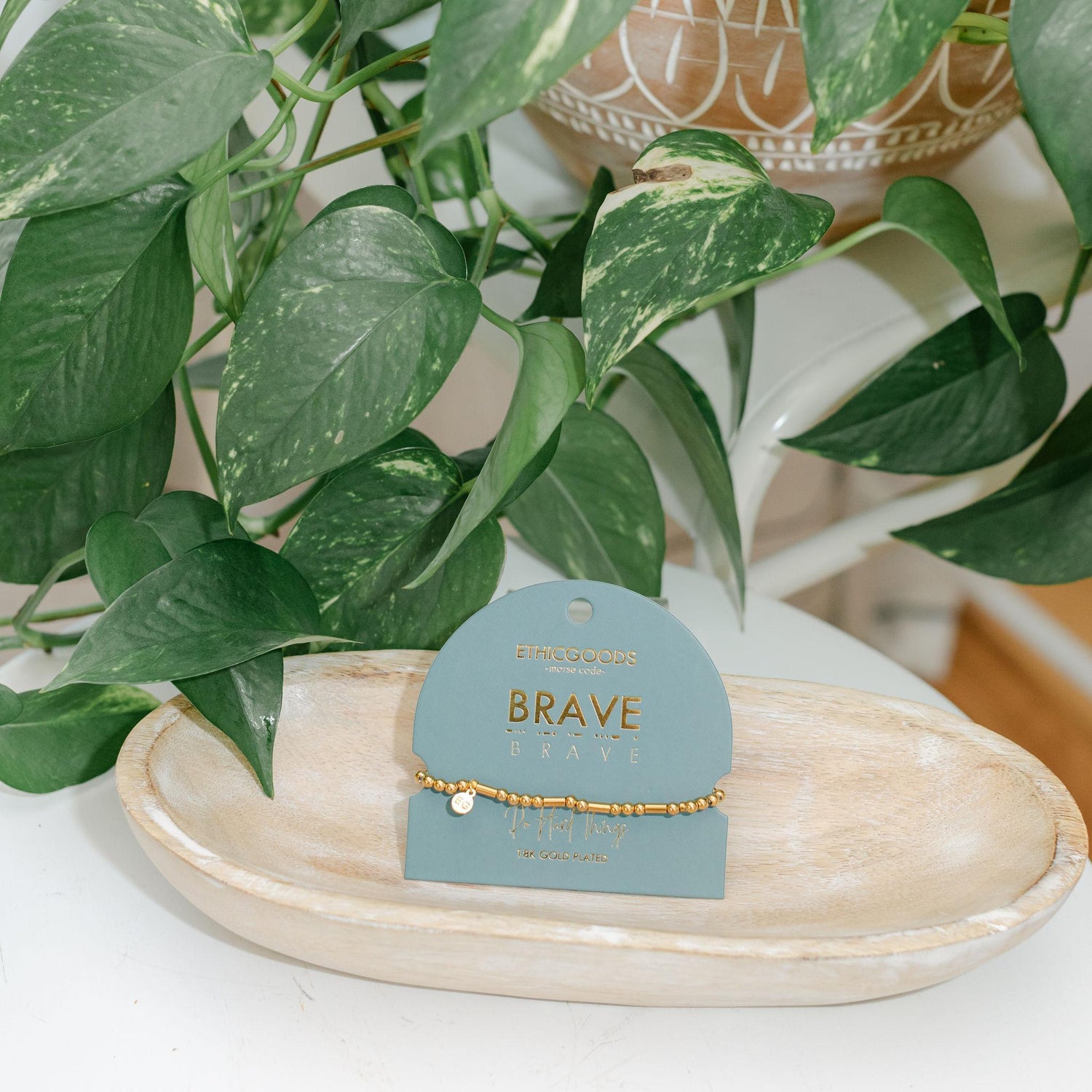 Bracelet on a card labeled &