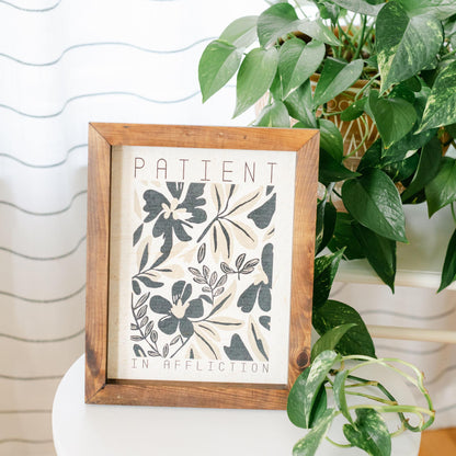 Framed artwork with floral design and text &