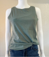 Green ribbed tank top on a mannequin with a plain background