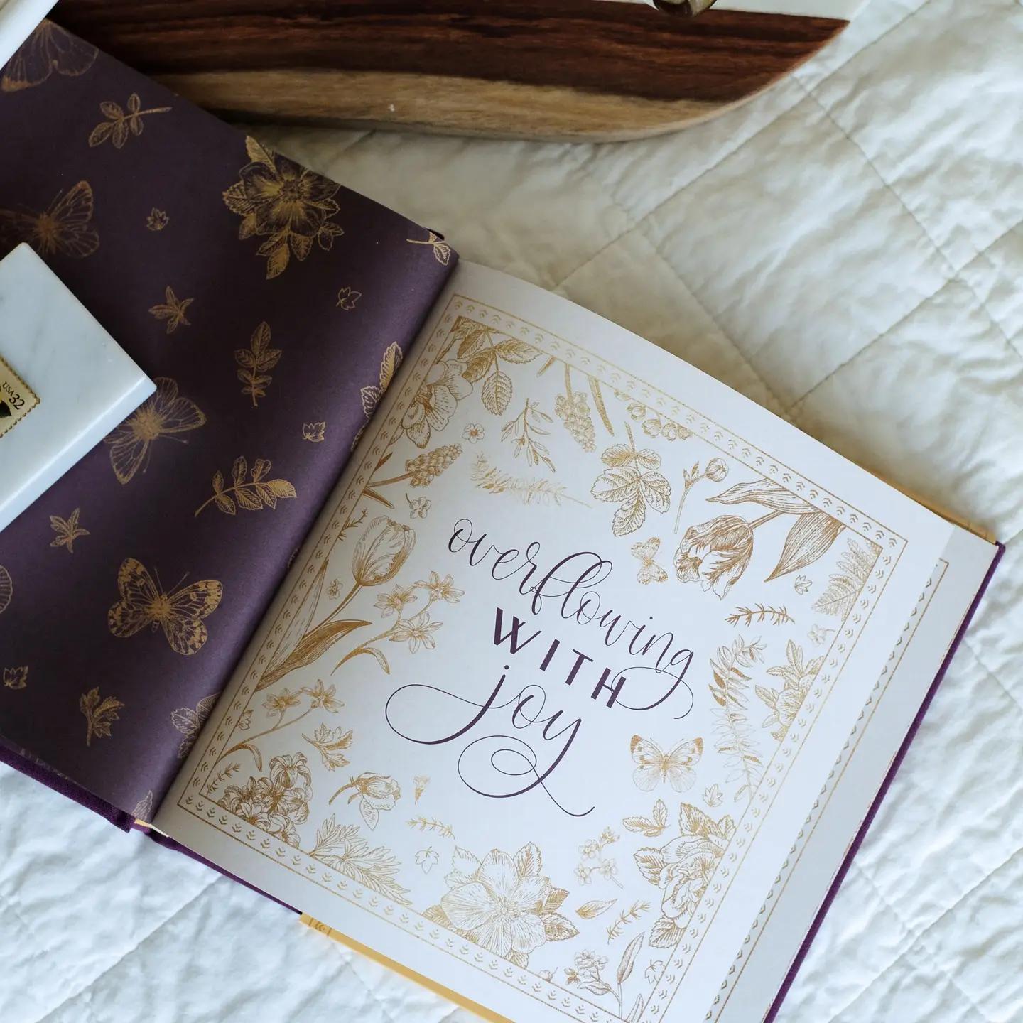 Open book with decorative cover and &