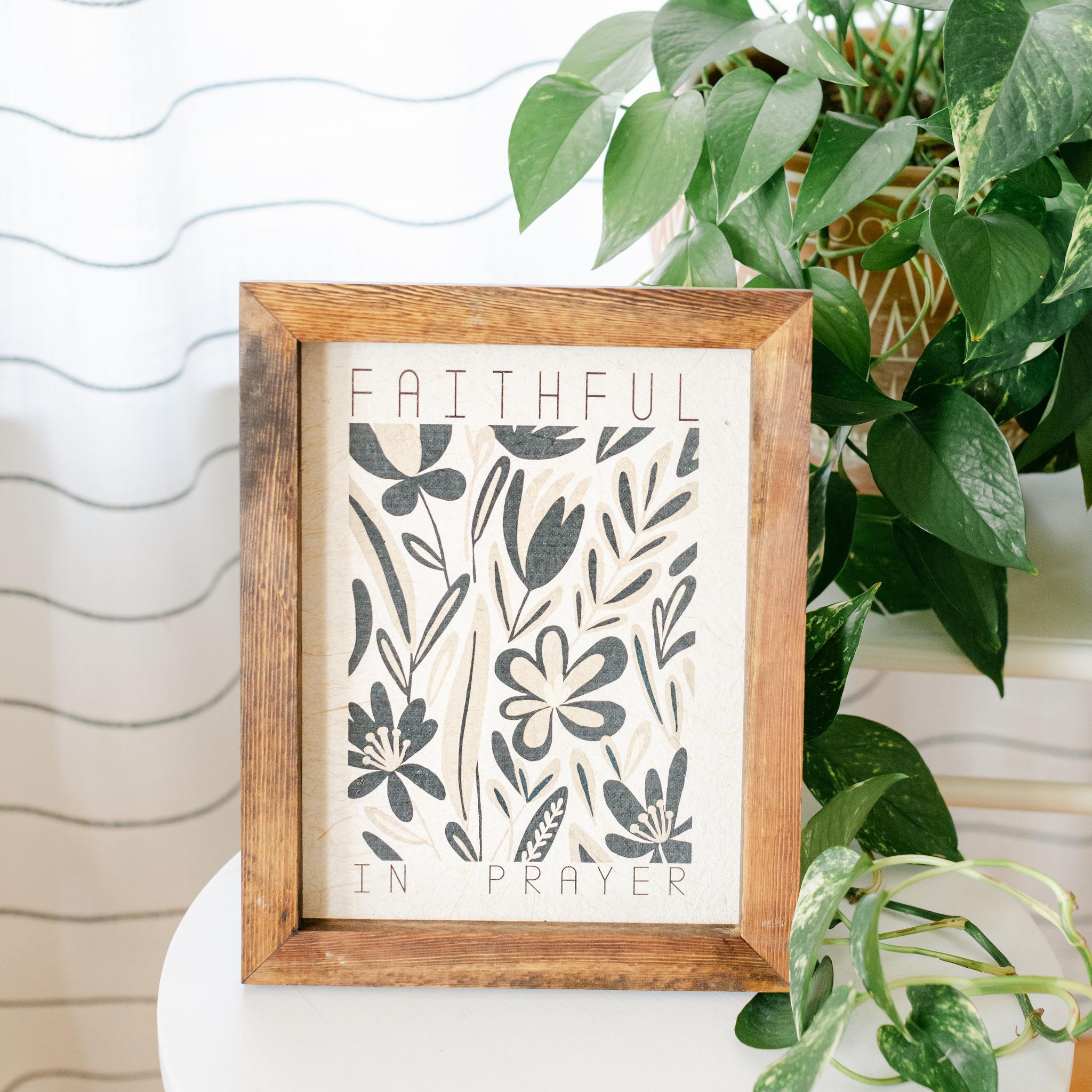Framed artwork with floral design and text &