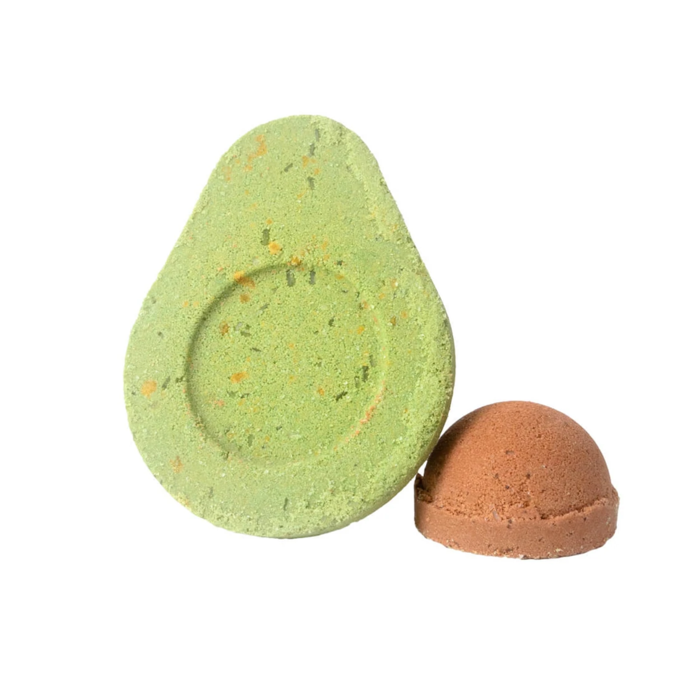 Green avocado-shaped bath bomb with a smaller brown sphere on a white background