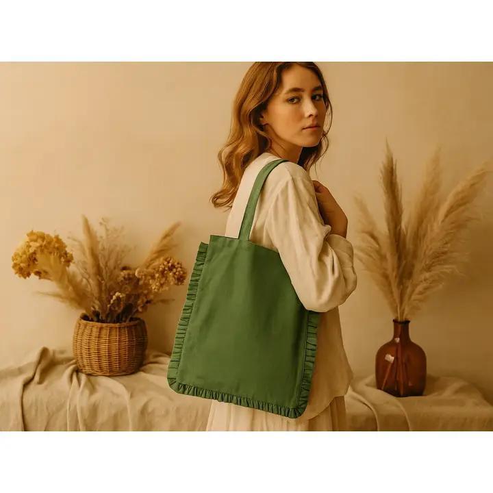 Woman carrying a green tote bag in a room with decorative plants.